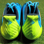 Adidas Predator Malice Control FG Signal Cyan/Signal Orange/Signal Green behind view