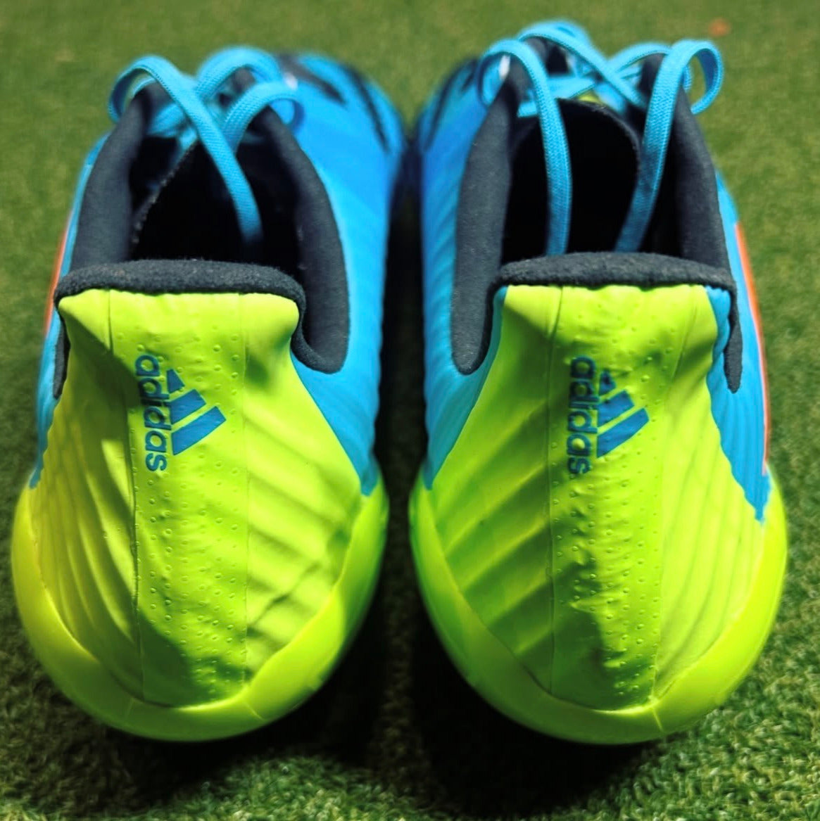 Adidas Predator Malice Control FG Signal Cyan/Signal Orange/Signal Green behind view